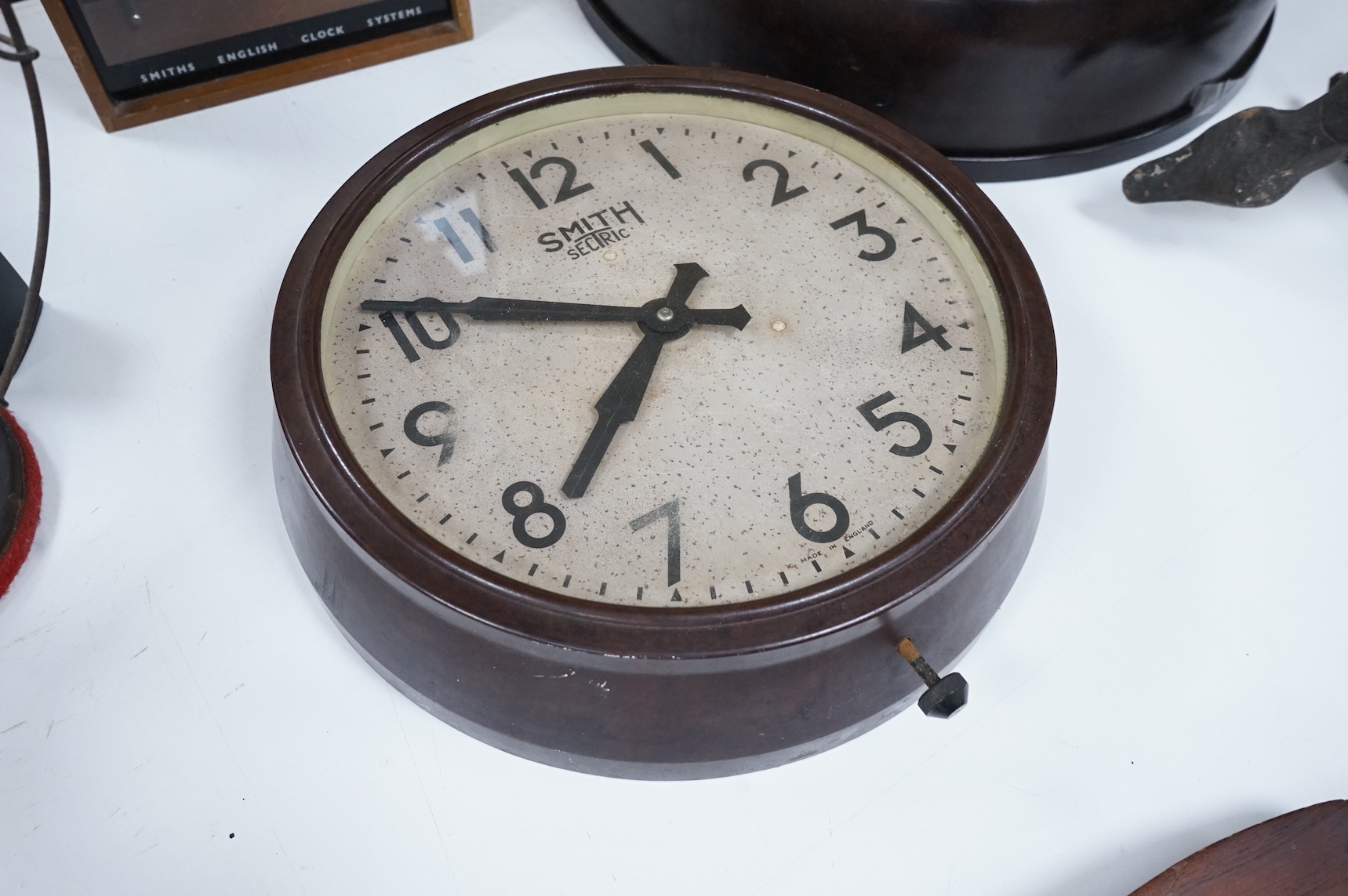 Two 20th century electric wall clocks, including a Smith’s Bakelite example, largest 47cm diameter